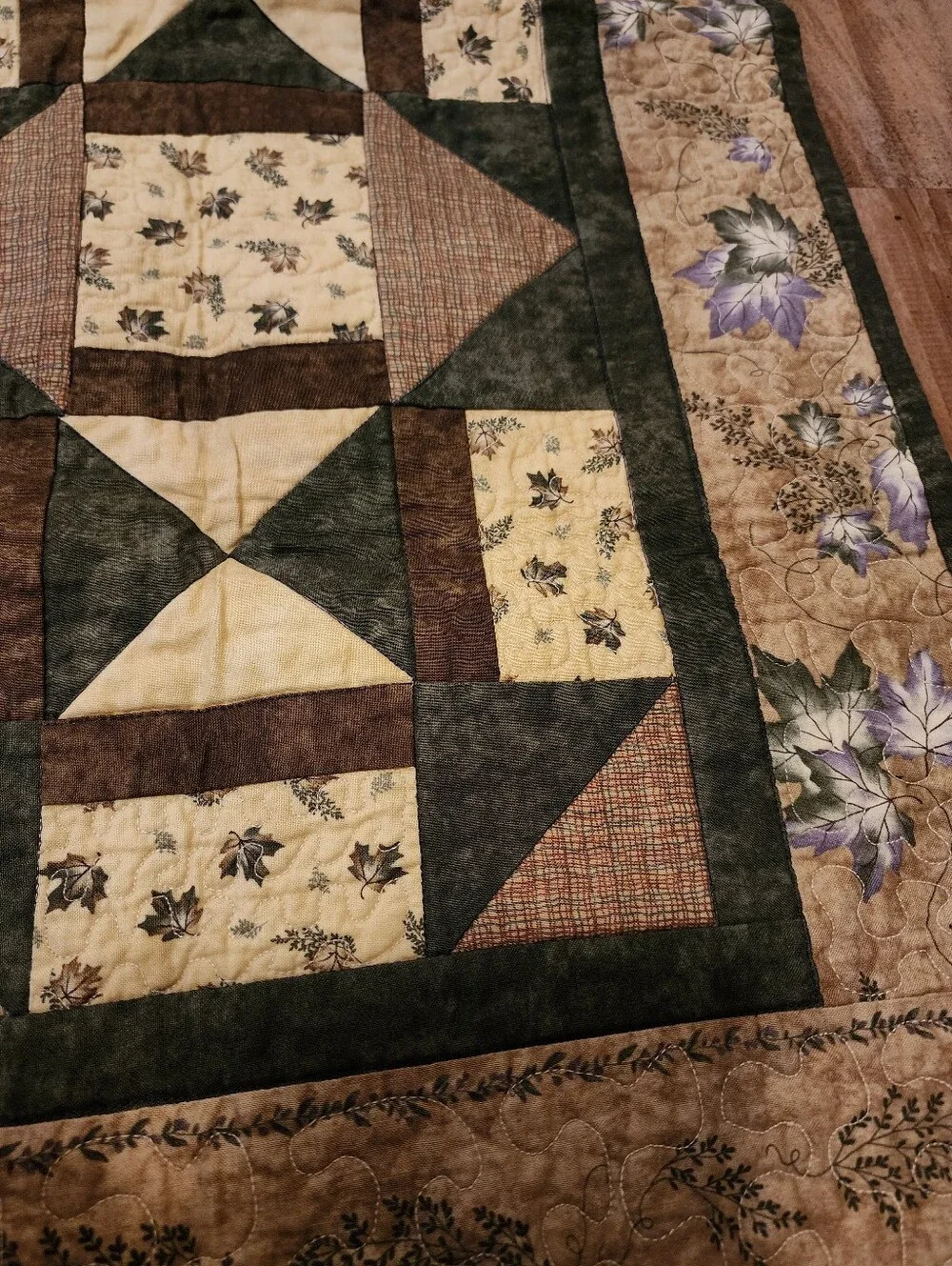 Green, brown and beige quilted table topper